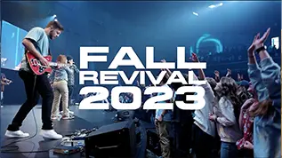 Video Thumbnail showing the ORU praise and worship team on stage in front of students standing and signing along
