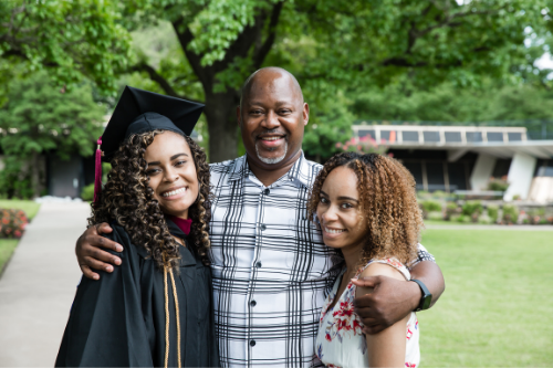 female grad and family